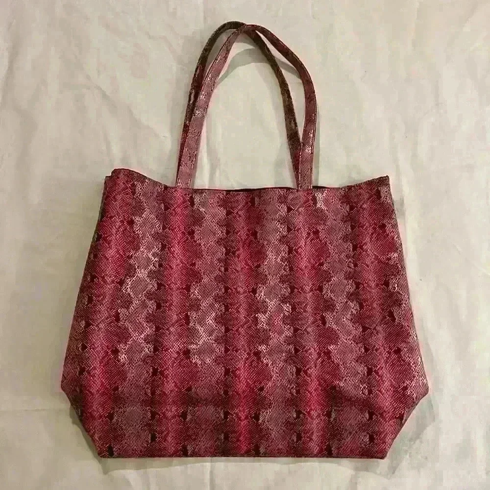 Saks Fifth Avenue tote bag, pink snakeskin, open, no closure, 10”handle,17”x 14”